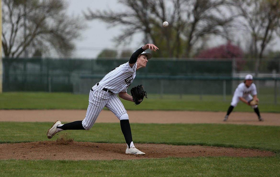 Moses Lake High School's Carson Janke throws a pitch in the first game of the day against Brewster High School on Saturday at Larson Playfield in Moses Lake.