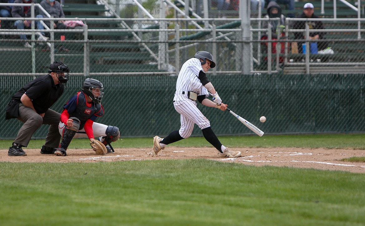 Zane Harden fires a hit for Moses Lake High School on Saturday in the 13-5 win over Brewster High School at Larson Playfield.