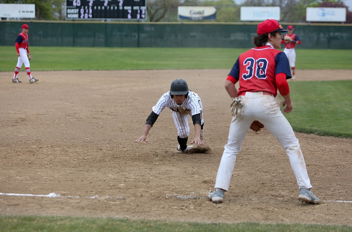 Moses Lake High School's Leo Cortez slides into third base on Saturday afternoon at Larson Playfield in Moses Lake.