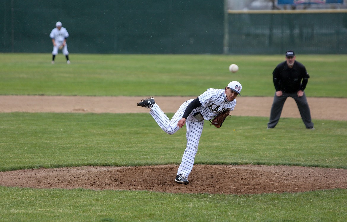 Moses Lake High School's Jacob Martinez throws a pitch after coming in for relief in the first game of the day versus Brewster High School at Larson Playfield.