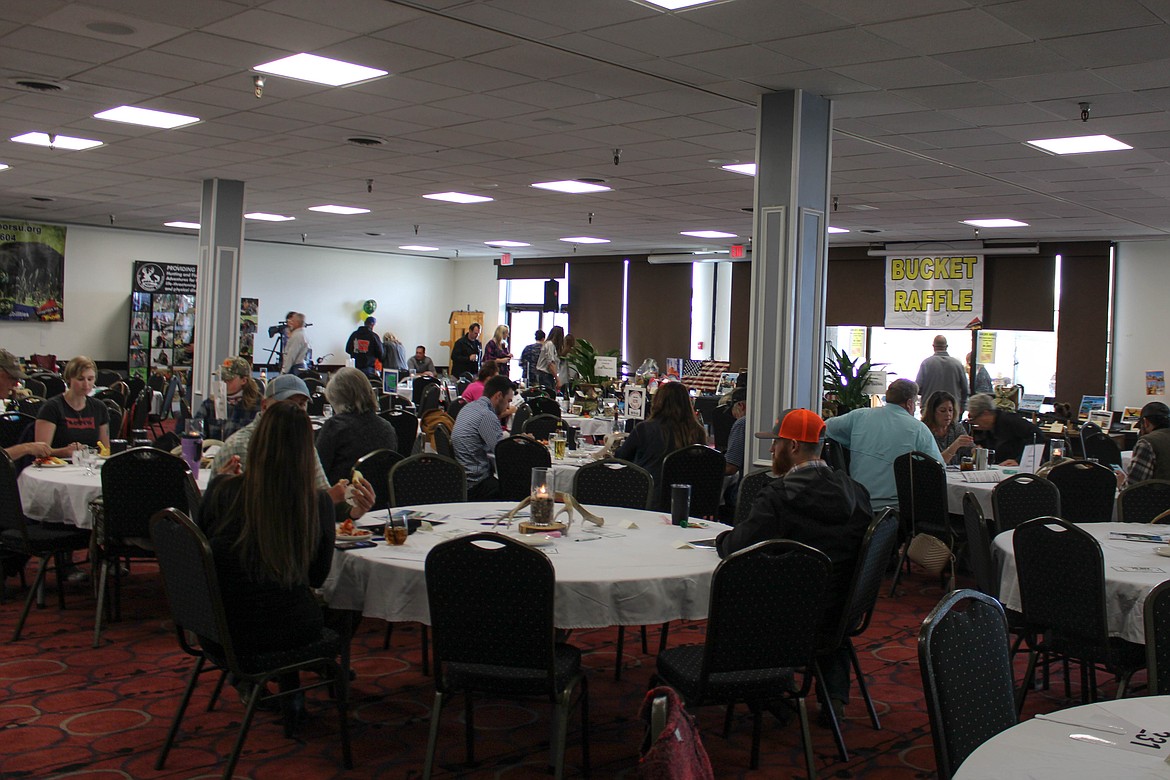 Donors find their tables at Saturday's Youth Outdoors Unlimited Auction at the Best Western Plus Lake Front Hotel.