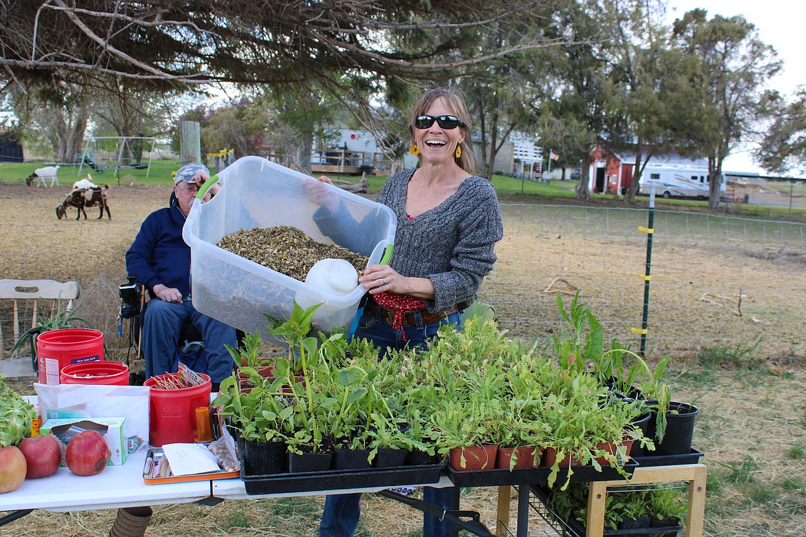 Moses Lake resident Stacy Bishop displays her seeds and plants at the Otaku Farms Barter Faire on Sunday.