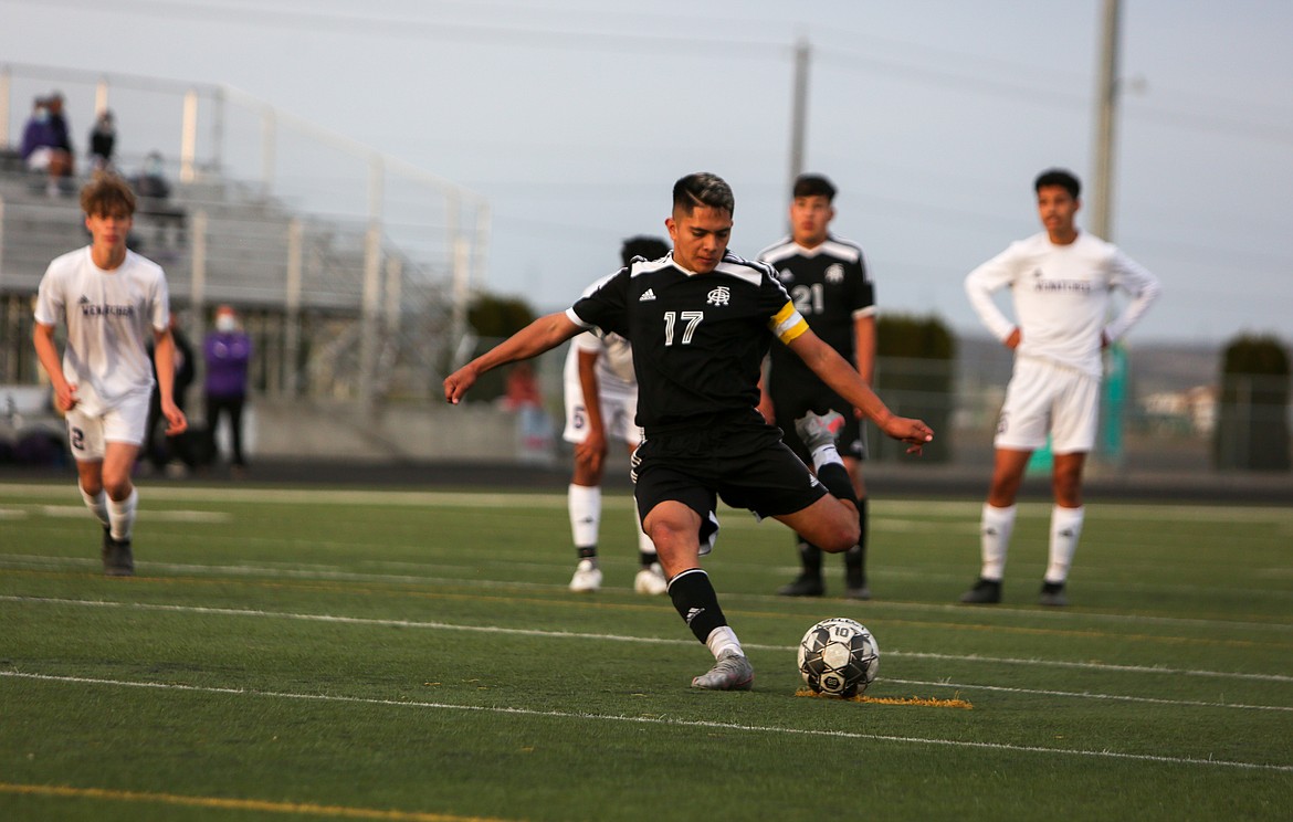 Royal High School's Eliseo Romero takes the penalty kick to score in the second half against Wenatchee High School on Friday night in Royal City.