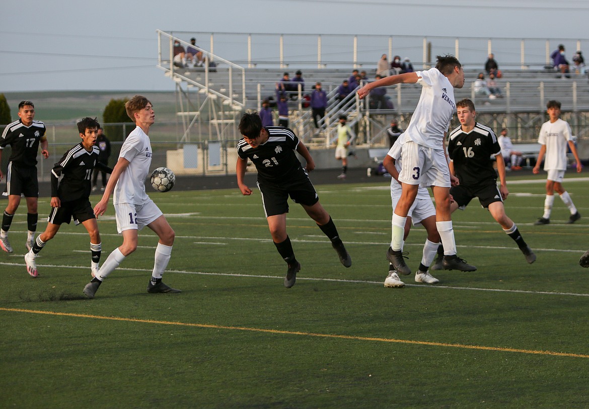 Royal High School's Luis Cruz heads a ball toward the Wenatchee goal in the second half on Friday night in Royal City.