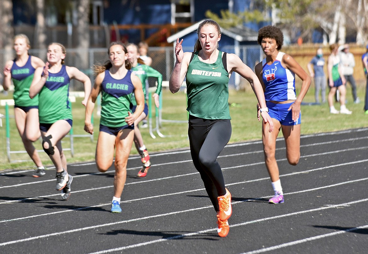 Whitefish freshman Brooke Zetooney sprints to a first-place finish in the 100 meter dash at Whitefish High School on Tuesday, April 20. (Whitney England/Whitefish Pilot)