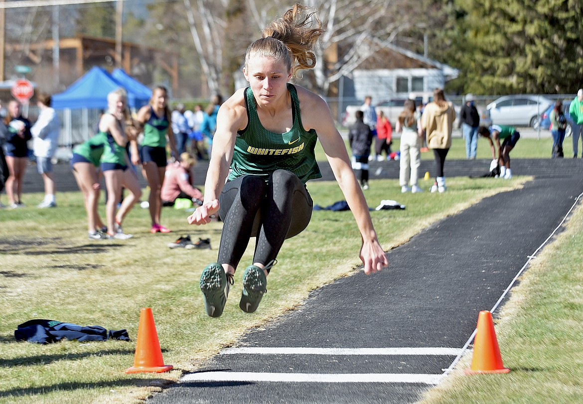 Whitefish's Tommye Kelly competes in the long jump event at Whitefish High School on Tuesday, April 20. (Whitney England/Whitefish Pilot)