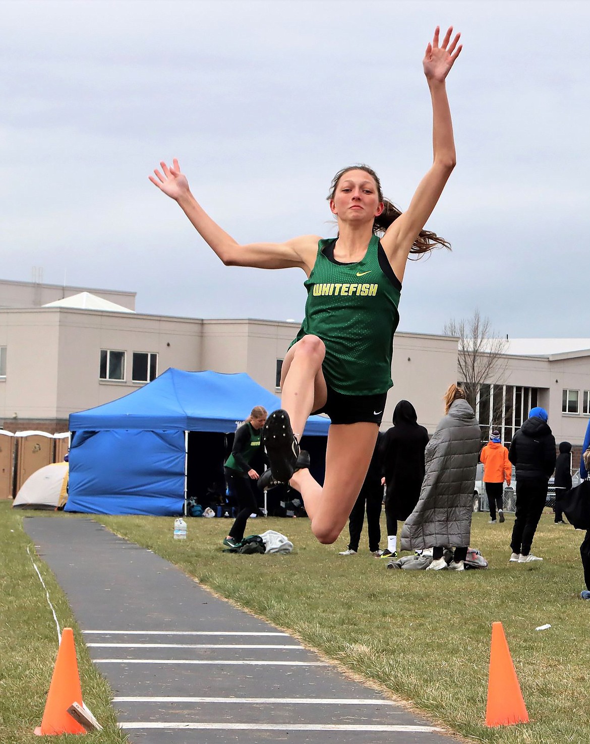 Erin Wilde competes in the long jump at the Iceberg Meet in Columbia Falls Saturday. (Greg Nelson photo)