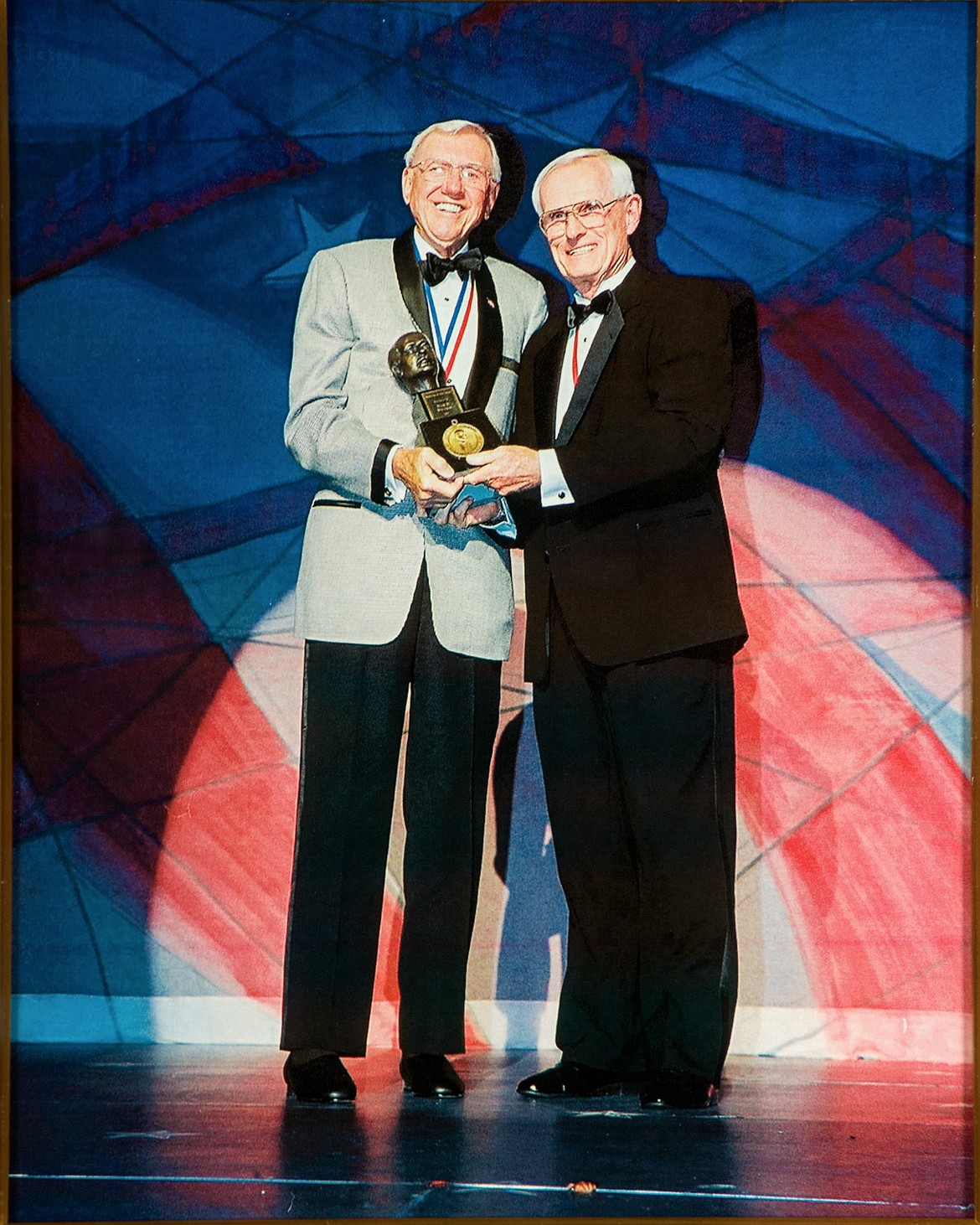Harry S. Rinker hands Duane the Horatio Alger Award in 2004.