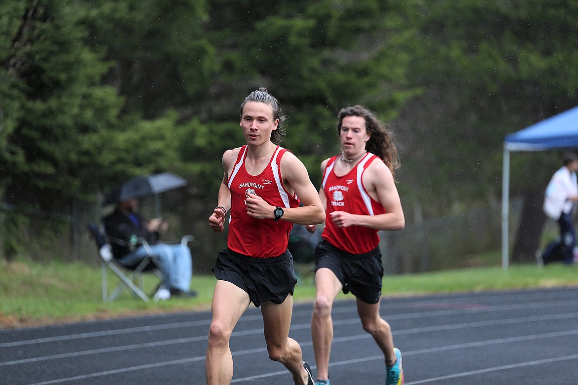 Nikolai Braedt (front) leads teammate Jett Lucas in the 3200 on Saturday.