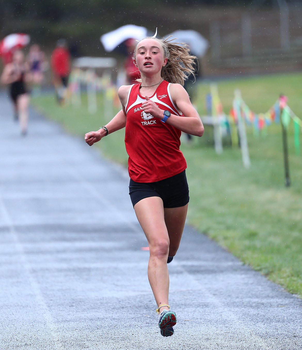 Freshman Grace Rookey crosses the finish line in first in the 1600 on Saturday.
