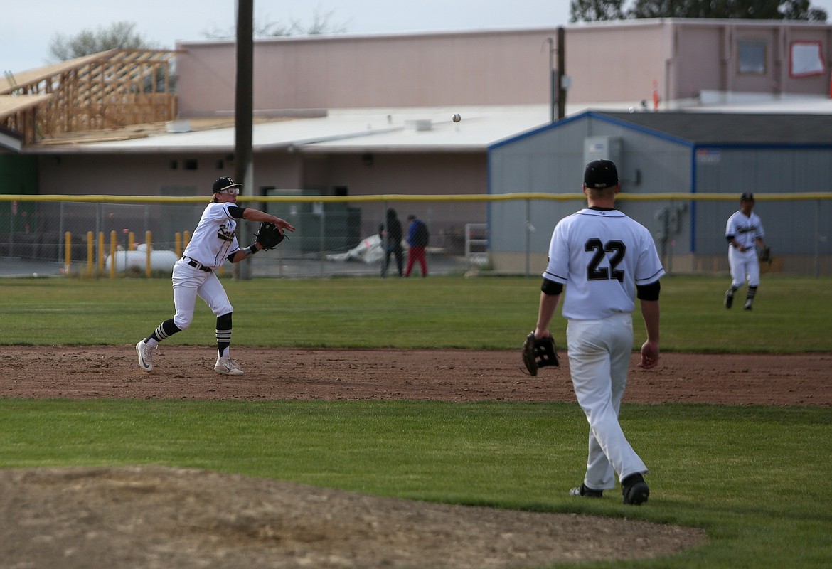 Dylan Allred makes a throw to first base for the out for Royal High School in the win over Lake Roosevelt on Tuesday afternoon in Royal City.