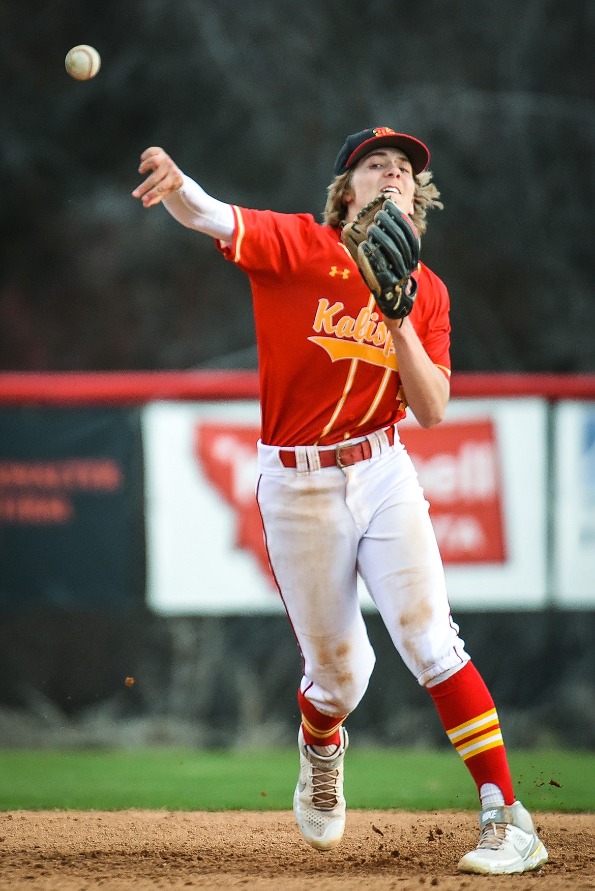 Kalispell Lakers AA shortstop Gage Brink (3) fires to first against the Mission Valley Mariners at Griffin Field on Wednesday. (Casey Kreider/Daily Inter Lake)