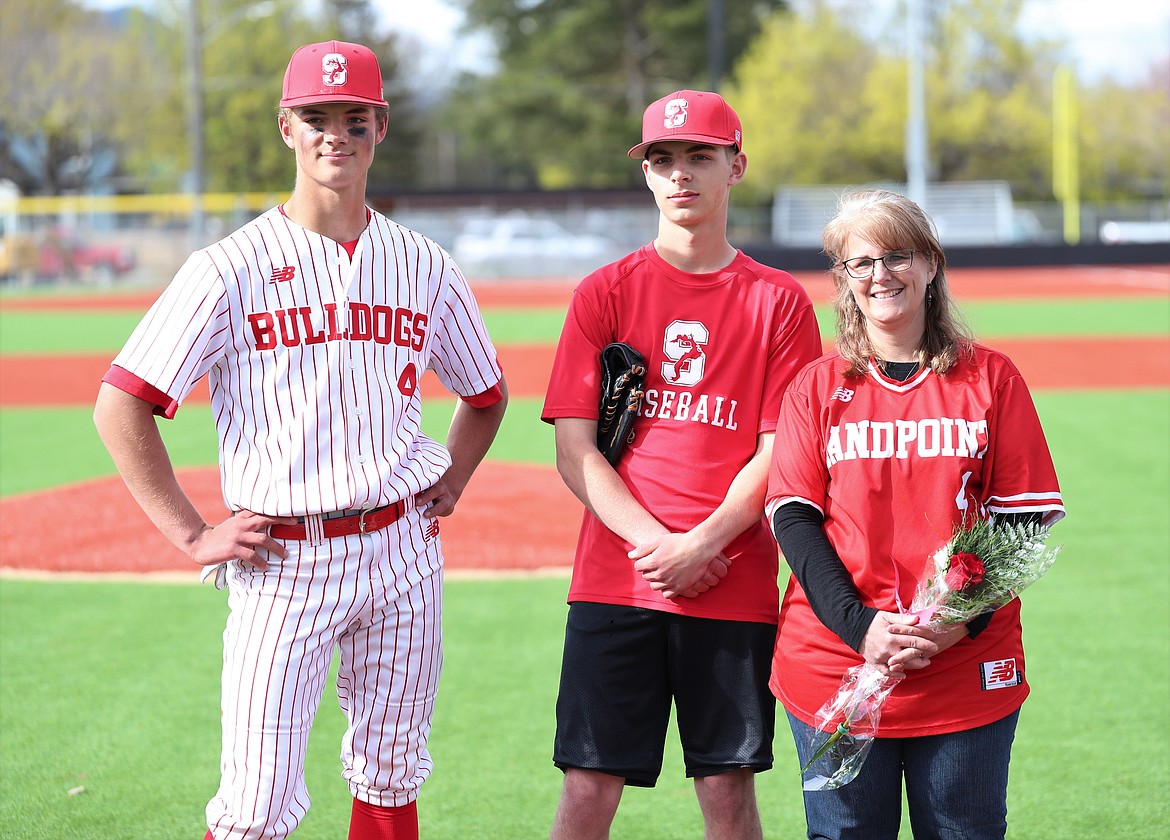 Avery Bocksch celebrates with family on Senior Night.