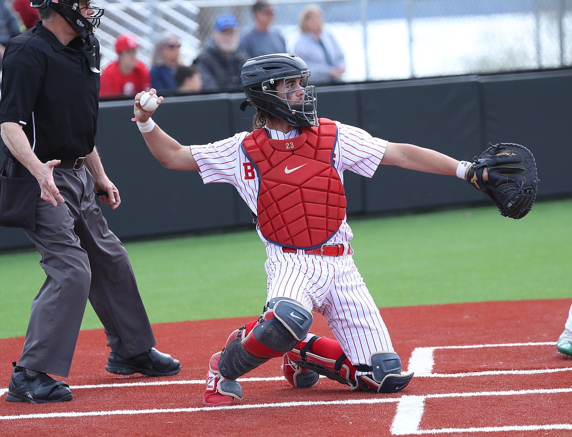 Catcher Trevor Brackett throws the ball back to the pitcher on Tuesday.