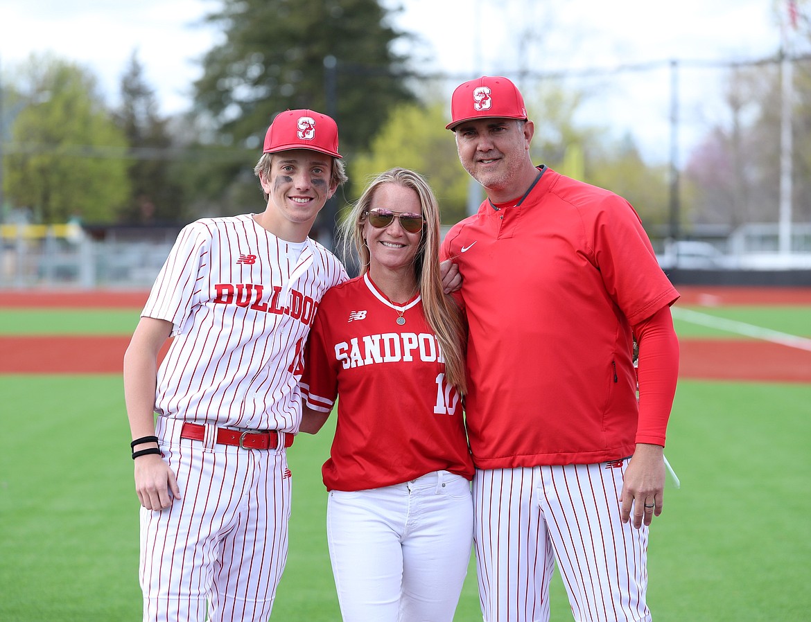 Max Thielbahr celebrates with family on Senior Night.