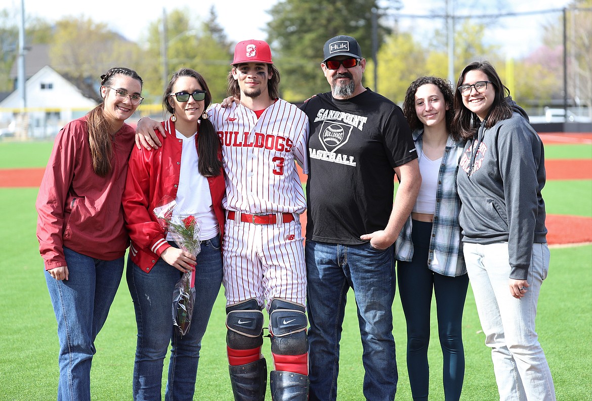 Trevor Brackett celebrates with family on Senior Night.