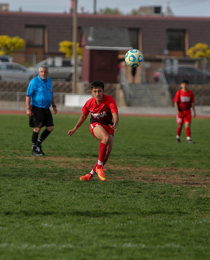 Othello's Anthony Ontiveros puts a shot toward goal from outside the box in the second half against Pullman High School on Thursday afternoon in Othello.