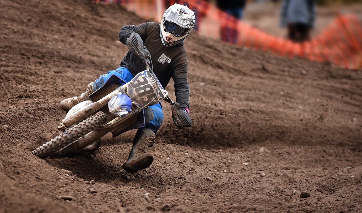 Shane Jones navigates a turn during afternoon action at the motocross races in Hungry Horse April 24. (Jeremy Weber/Daily Inter Lake)