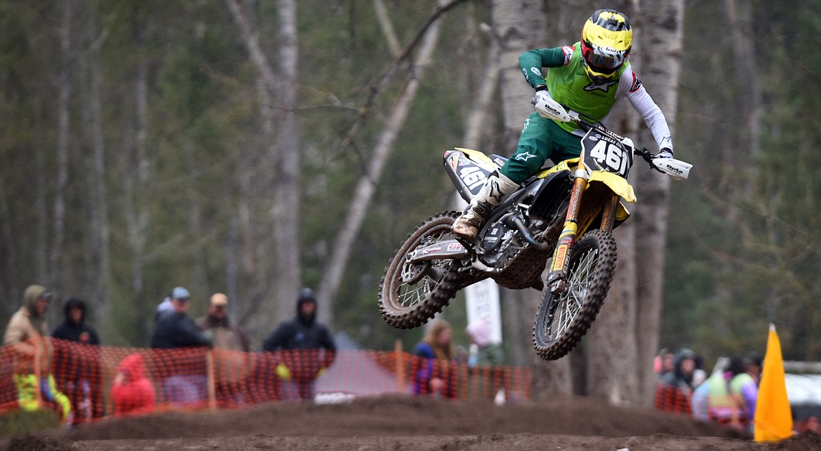Open pro class winner Thomas Richards looks to stick the landing during a jump at the Hungry Horse motocross races April 24. (Jeremy Weber/Daily Inter Lake)