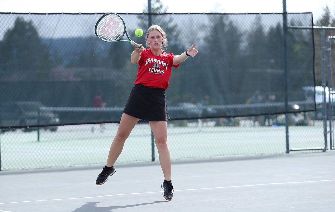 Patch Howard returns a serve during a mixed doubles match on Thursday.