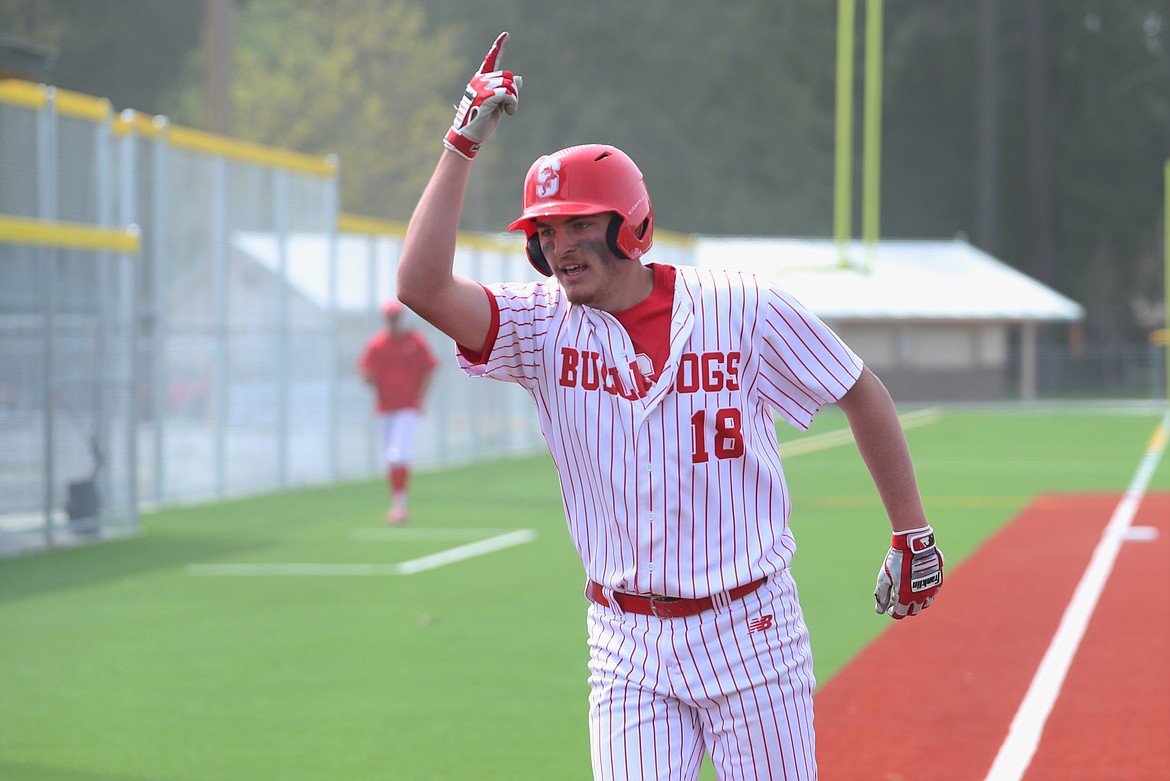 Senior Evan Williams crosses home plate after hitting a two-run homer in the second inning of the first game against Lewiston.