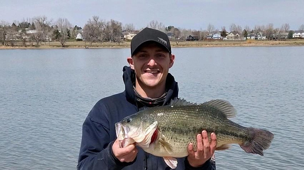 Brandon Wright displays a 9.575-pound, 22.5-inch largemouth bass he caught Saturday, April 24 from Lake Elmo in Billings Heights. The fish broke a record which stood since 2009. The previous record 8.8-pound bass was caught in Noxon Reservoir. (Photo courtesy Montana Fish, Wildlife & Parks)