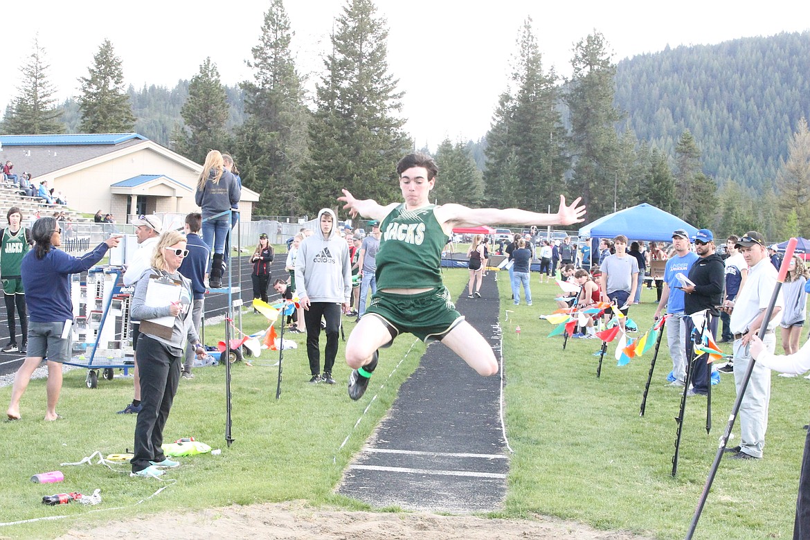 JASON ELLIOTT/Press
St. Maries senior Philip Keogh attempts to stick his landing during the long jump at the Timberlake Invitational. Keogh's best mark was 16 feet, 4 inches.