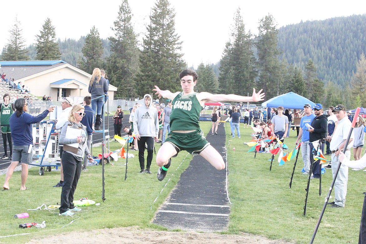 JASON ELLIOTT/Press
St. Maries senior Philip Keogh attempts to stick his landing during the long jump at the Timberlake Invitational. Keogh's best mark was 16 feet, 4 inches.