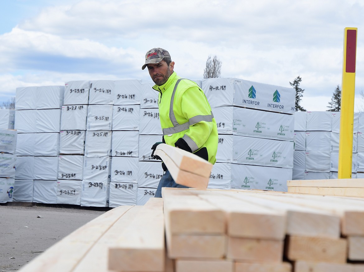 Assessing wood products--which grow scarcer and more expensive by the day--at Western Building Center in Columbia Falls.