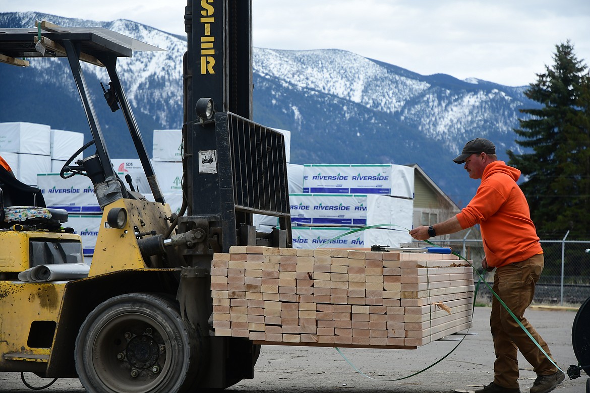 Hauling wood at Western Building Center in Columbia Falls.