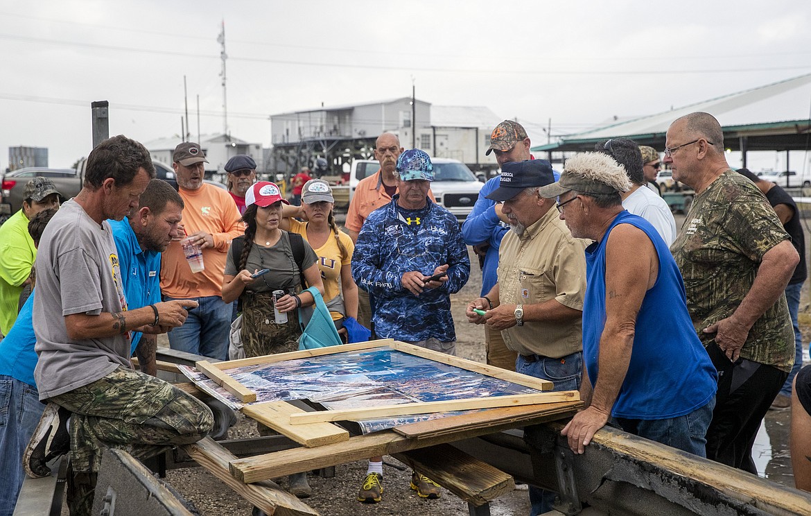 Scott Daspit, the father of missing Seacor Power crew member Dylan Daspit, suggests where people should search based on areas already visited, at Harbor Light Marina in Cocodrie, La., Tuesday, April 27, 2021. The United Cajun Navy and other volunteers joined forces to locate 7 missing Seacor Power crew members almost 2 weeks after the lift boat capsized about 8 miles from Port Fourchon during bad weather.