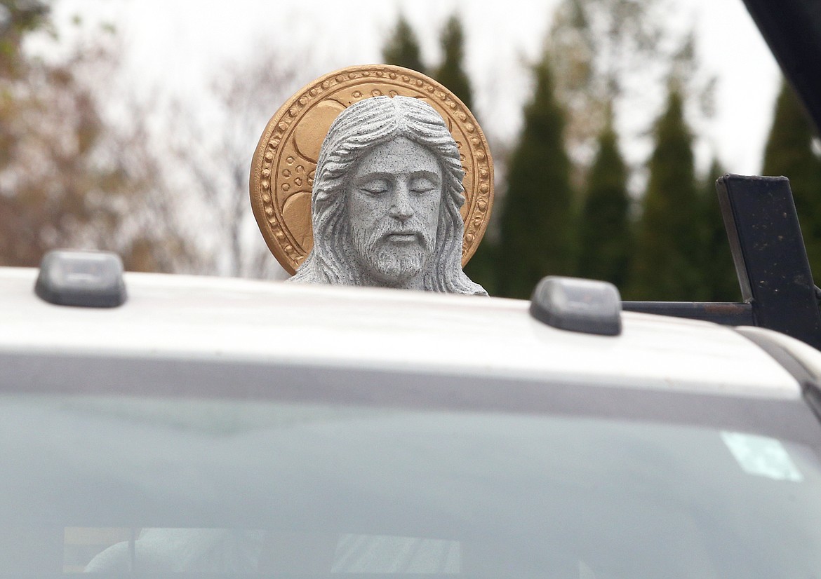 The statue of the risen Jesus waits to be put in its new home at St. Thomas Cemetery on Friday.