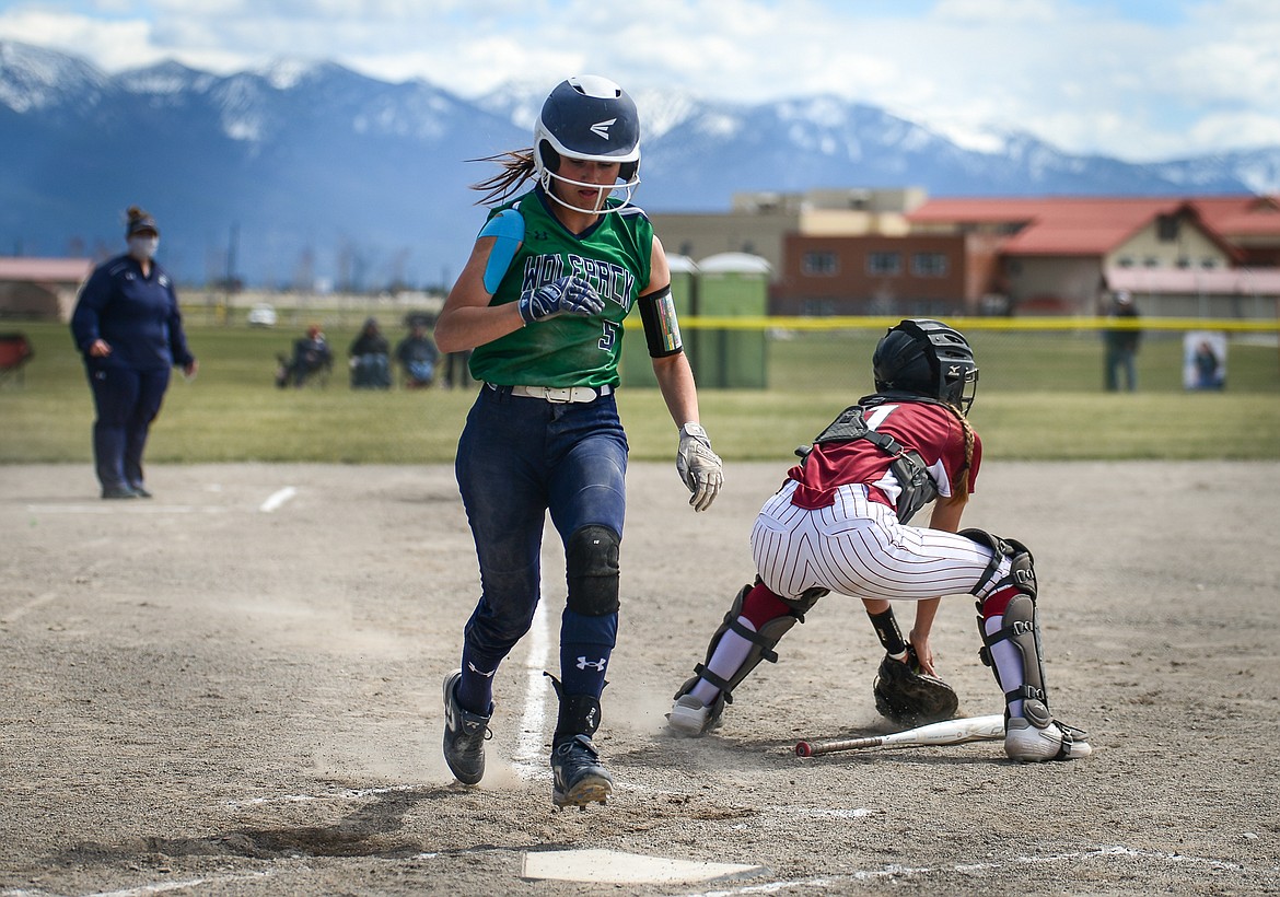 Glacier's Kenna Vanorny (5) crosses the plate in the first inning against Helena High at Glacier High School on Saturday. (Casey Kreider/Daily Inter Lake)