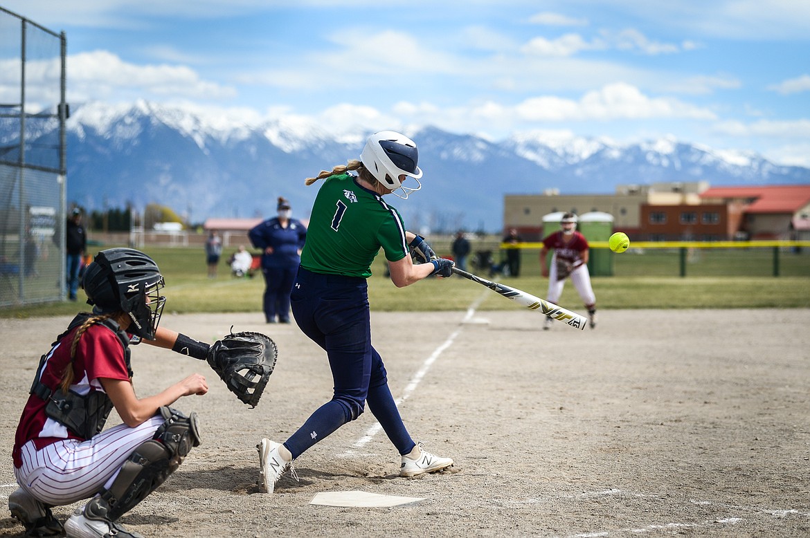 Glacier's Kynzie Mohl (1) connects on a solo home run in the bottom of the fifth against Helena High at Glacier High School on Saturday. (Casey Kreider/Daily Inter Lake)