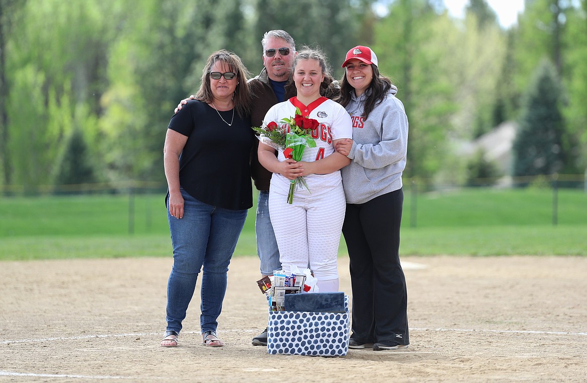 Kinzie Ward celebrates Senior Night with her family.