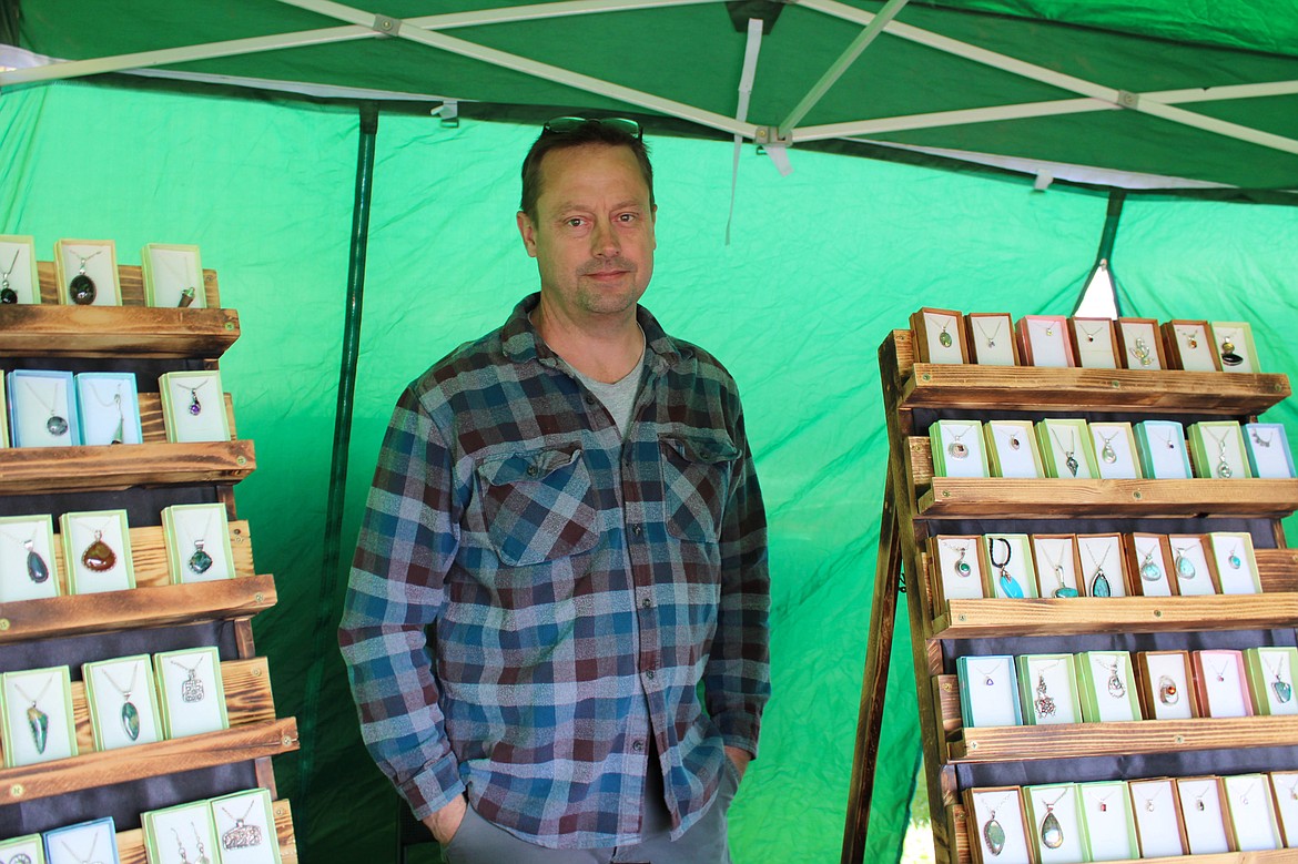 David Waller of DnD Jewelry Shop stands in his booth at the Moses Lake Farmers Market on Saturday.