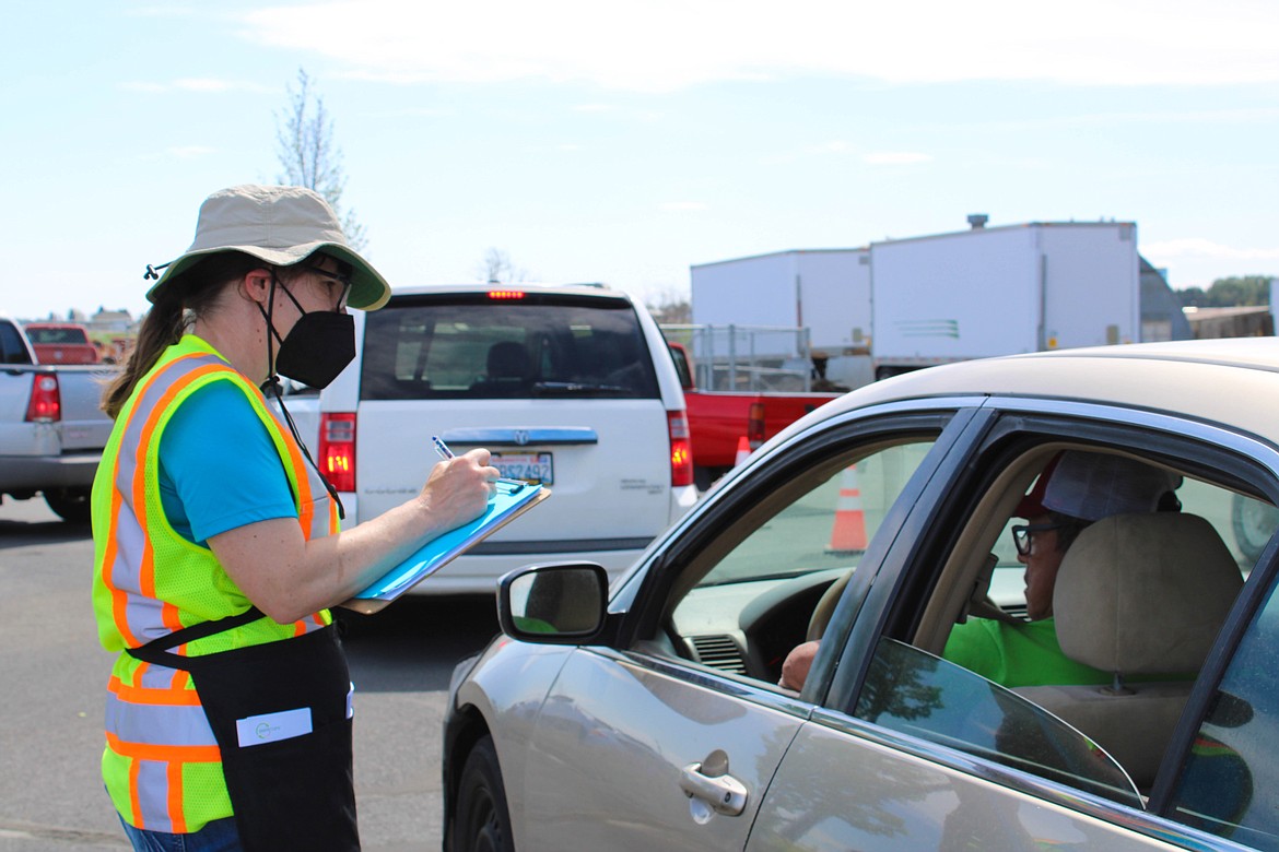 Grant County Public Works Solid Waste program coordinator Joan Sieverkropp takes inventory on incoming waste at the Household Hazardous Waste event on Saturday.
