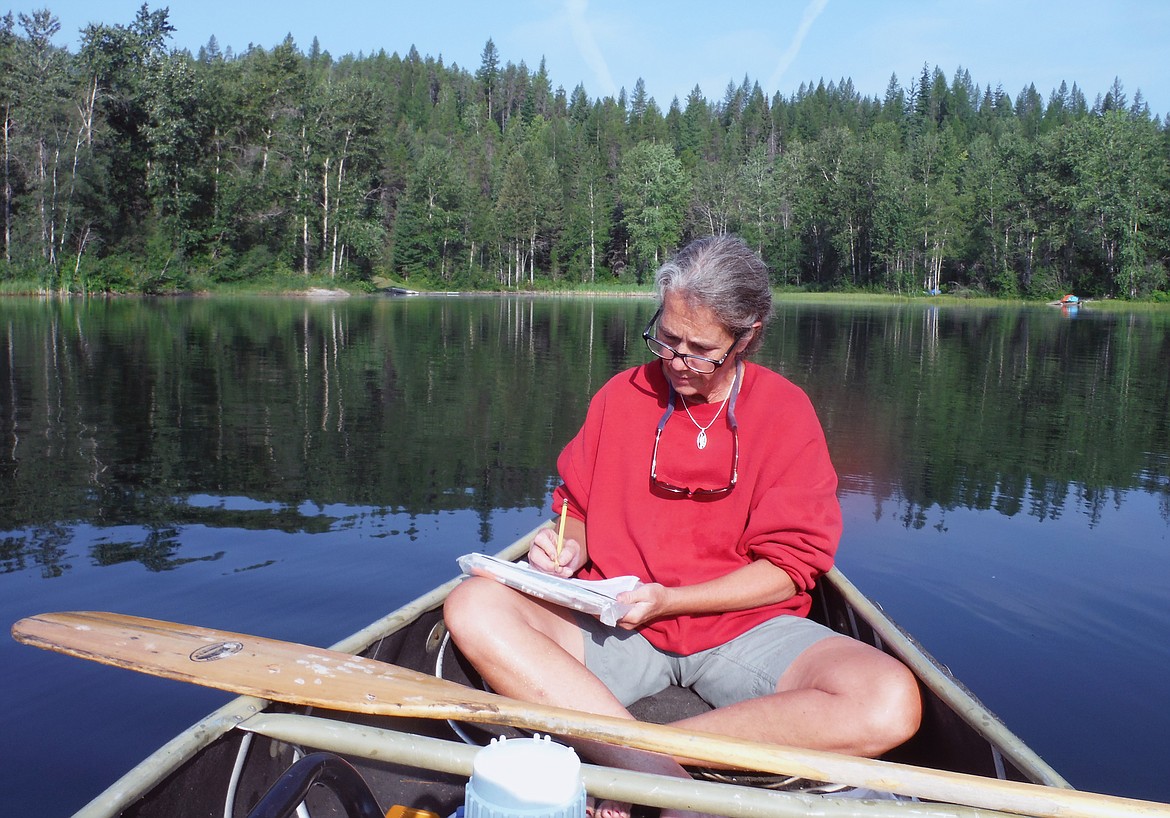 NMLN volunteer Susie Bouton records data for Bailey Lake. (Courtesy photo)