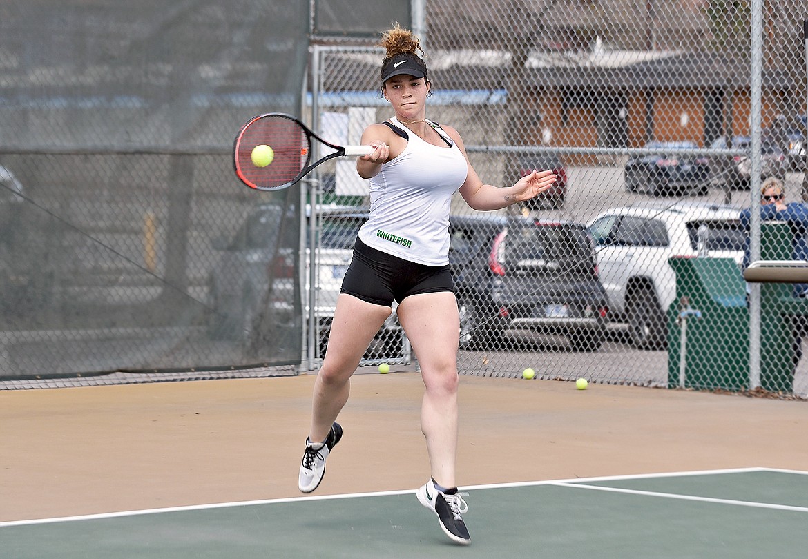 Lady Bulldog Gracie Smyley fires a return while playing a No. 1 singles match against Columbia Falls' Hannah Schweikert on Tuesday, April 27 in Whitefish. (Whitney England/Whitefish Pilot)