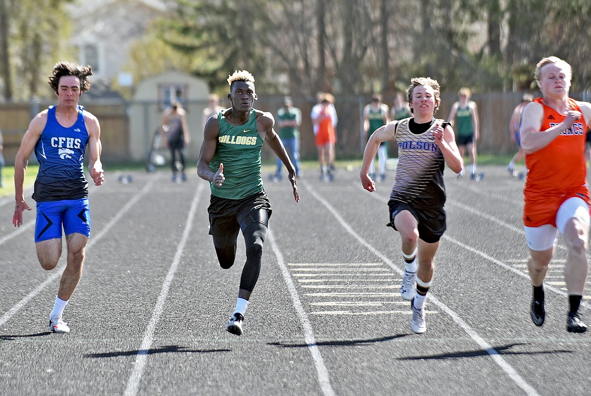 Whitefish's Marvin Kimera sprints to a personal best and fourth-place finish in the boys 100 meter dash at the Whitefish ARM meet on Saturday. (Whitney England/Whitefish Pilot)