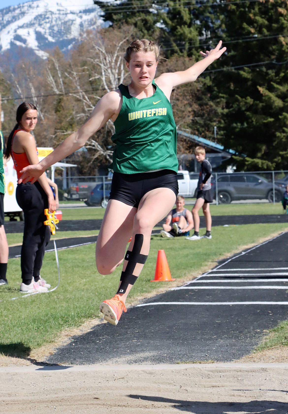 Bulldog Bailey Smith competes in the long jump at Whitefish High School. (Greg Nelson photo)