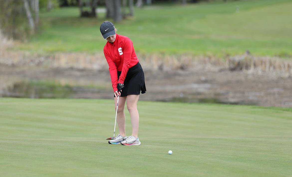 Camille Neuder putts on Monday.