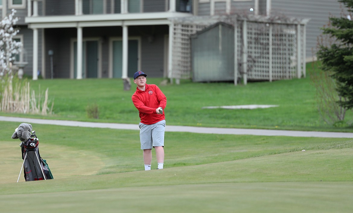 Harley Wilks chips the ball onto the green on Monday.