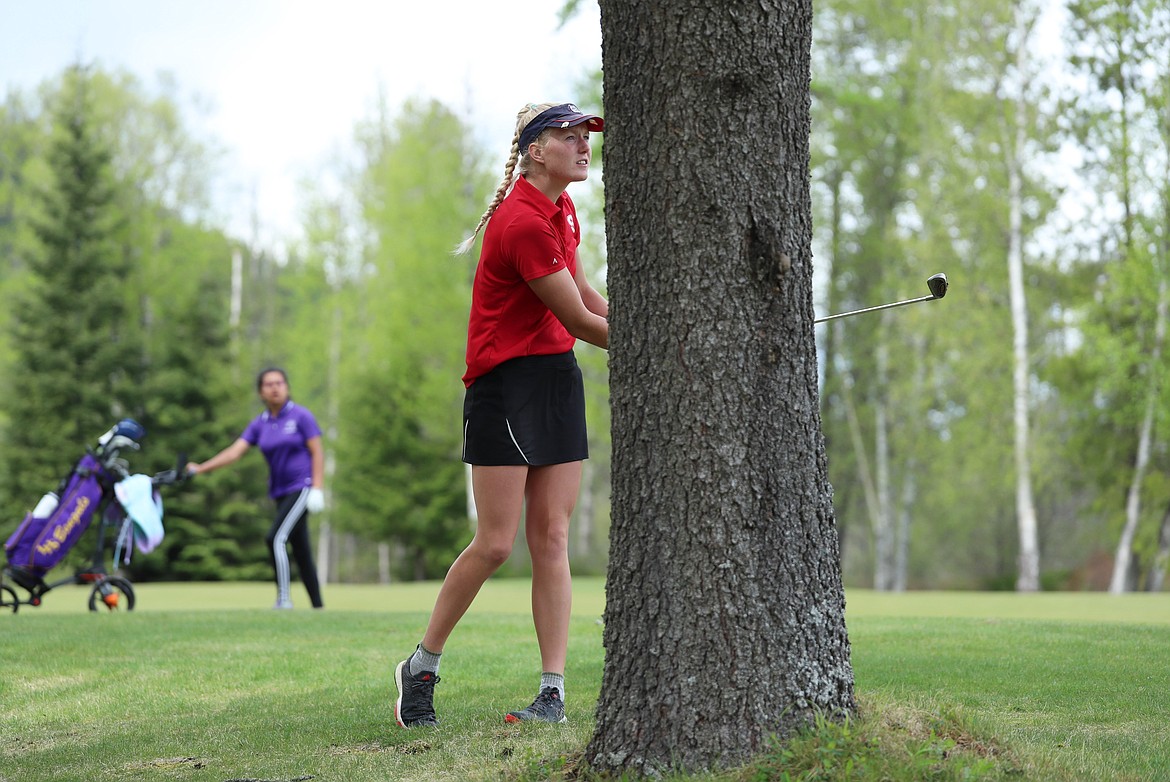 Hattie Larson hits a shot from the rough on Monday.