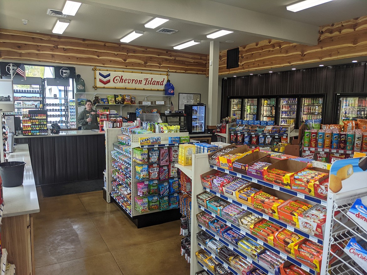 Jessie Watson watches over the front counter of the new Carousel convenience store.