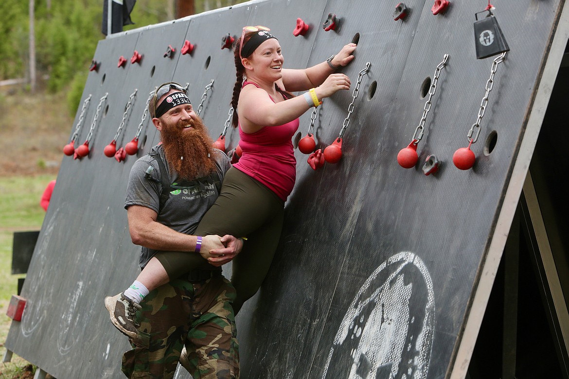 Jeremiah D'Attilio gives another competitor a lift at the Olympus Wall obstacle during the Spartan Super on Sunday.
Mackenzie Reiss/Bigfork Eagle