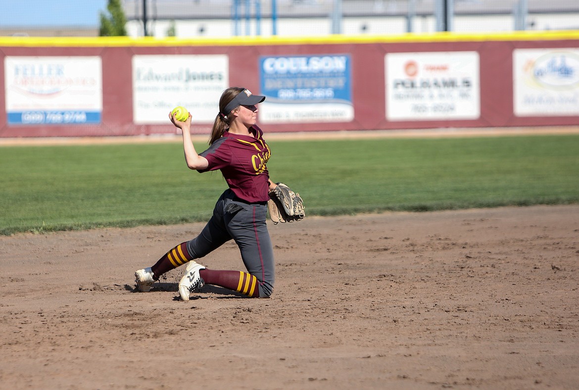 Shortstop Ciarrah Knoll throws the ball to first base from her knees after making an acrobatic catch on Tuesday afternoon at Moses Lake High School.