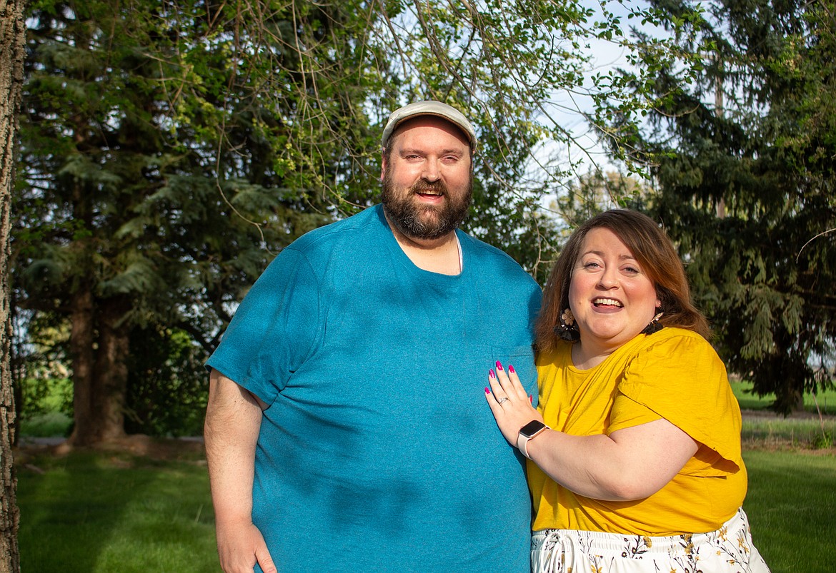 Michael and Emily Duvall smile together in the front yard of their home outside Moses Lake on Monday evening.