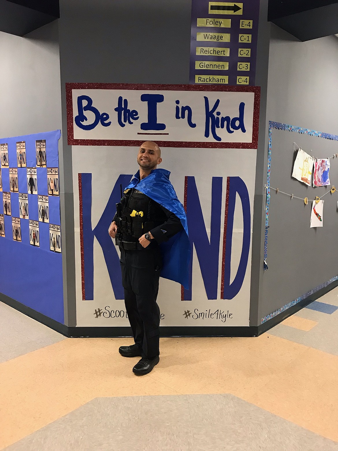 Othello Police Department school resource officer Aaron Garza in the hallway at Scootney Springs Elementary.