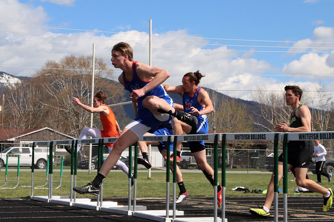 Wyatt Duke races over a hurdle during the 110-meter event.
Courtesy Greg Nelson